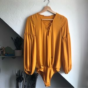 Golden Lace-Up Bodysuit with Billowy Sleeves